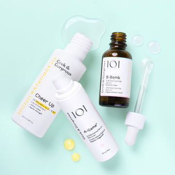 An example G&G set with the liquid exfoliant: Cheer Up, the 10% Niacinamide serum: B-Bomb and the 0.05% Retinal serum: A-Game 5. The products are on a light mint background with the textures showing.