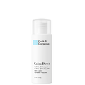 A bottle of the travel-sized (1 fl.oz. /30 ml) version of Calm Down exfoliator, on white background.